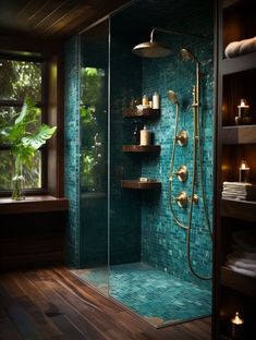 a walk in shower sitting next to a window with candles on the shelf and shelves