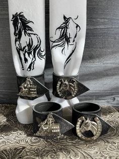 the black and white napkins are decorated with horse heads on them, along with other decorative items