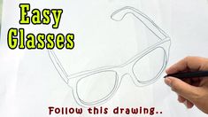 a person drawing glasses on a piece of paper with the words easy classes follow this drawing