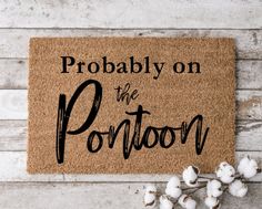 a door mat that says, probably on the porch with cotton in front of it