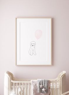 a baby's room with a crib and pink walls