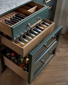 an open drawer with bottles in it