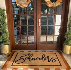 a welcome mat on the front door of a house