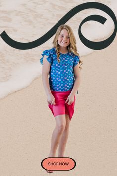 Shop the Girl's Chloe Swim Top With Knee Length Swim Skort for your daughter! It's the perfect swimwear for your little girl on your next beach trip! With a ruffle sleeve, round neckline and side ruching - it is so cute! You're sure your daughter is covered with the knee length swim skort pair. Follow Calypsa for more cute comfy kids summer swimwear fashion! Cute Comfy, Swimwear Fashion