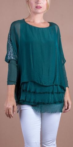 Silk Kaftan Style Blouse with Frayed Raw Edge Hemline. Features Sequin Detail on the Shoulders and Soft, Stretchy Knit Sleeves. 70% Viscose, 30% Silk Exterior | 95% Viscose, 5% Elastic Interior Made in Italy Fits Sizes XS- XL Model 5'7" Luxury Green Viscose Top, Bohemian Silk V-neck Tunic, Italy Fits, Kaftan Style, Silk Kaftan, Style Blouse, Knit Sleeve, Print Blouse, Women Clothes