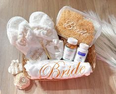 a basket filled with personal care items sitting on top of a wooden table next to feathers