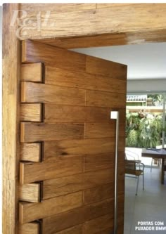 an open wooden door leading into a dining room