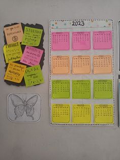 several sticky notes and magnets are displayed on a table with the numbers 2013 - 2013