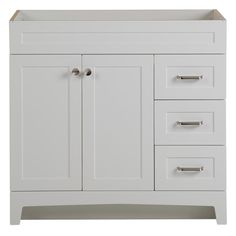 a white bathroom vanity with drawers and cupboards