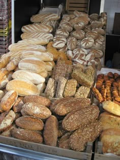 an assortment of breads and pastries on display