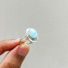 Important : PLEASE ENTER YOUR PHONE NUMBER IN THE "NOTE TO SELLER" SECTION DURING CHECKOUT, SO THAT THE DELIVERY CAN BE HASSLE FREE.Material: Solid Sterling silver Stone: Larimar stone size: varies( According to the ring sizes)ships worldwide from India925 stampedHandmade itemOur products are totally handmade and made with high quality gemstones and 925 solid sterling silver.If you believe in buying top quality products for yourself and for your family and friends, SilverDynasty is the place whe Round Larimar Rings As A Gift, Earth Healing, Ring Everyday, Larimar Ring, Handmade Silver Ring, Larimar Rings, Everyday Ring, Inner Wisdom, Larimar Stone