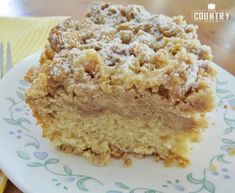 a piece of cake sitting on top of a white plate with a fork next to it