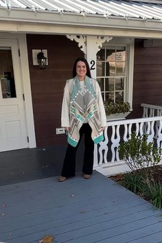 The Awendea Wrap - Short ( means one who is a beautiful morning)  Style No. AWDA NWBCN - SRT - Agawam Turquoise     * Fabric:  New Beacon; available in 5 colors / patterns       Agawa Gray Turquoise; Powderhorn; Arrow; Multi Desert Sand,         Agawa  Gray Rust;      * Luxuriously soft  and flowy 60% cotton / 30% acrylic / 10 % poly     * Cut flare for easy styling, softly folding in the front with drapery lapel     * Light weight and great for traveled     * Wear it over a dress or your favorite sweater!     * Tailored made and finished inside seams     * Dry Clean is best Shaw Women, A Beautiful Morning, Turquoise Fabric, Wrap Shorts, Woman Weaving, Desert Sand, Favorite Sweater, Beautiful Morning, Shawls And Wraps