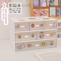 the drawers are decorated with cartoon stickers