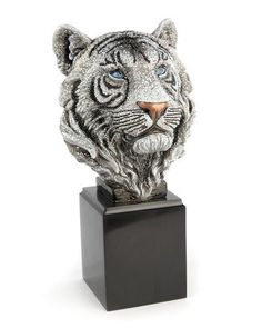 a silver and black tiger head on top of a wooden block with a white background