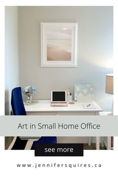 a white desk topped with a laptop computer next to a wall mounted art piece in a home office