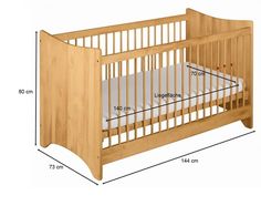 a crib is shown with measurements for the mattress and side rails on it's sides