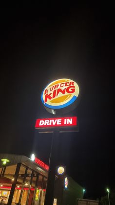 burger king drive in sign lit up at night