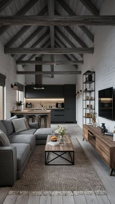 a living room filled with furniture and a flat screen tv on top of a wooden table