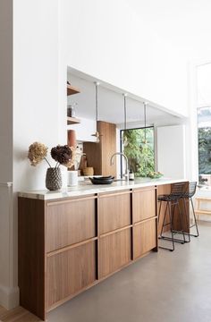 the kitchen is clean and ready to be used as a dining room or living room