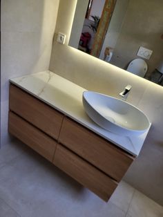 a bathroom with a sink and mirror in it