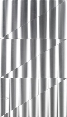 a close up view of a metal surface with wavy lines on the outside and inside