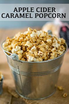 an apple cider caramel popcorn in a metal bucket