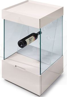 a wine bottle is in a glass case