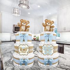 two diapers stacked on top of each other with a teddy bear sitting on top