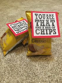 two bags of chips sitting on top of a carpeted floor next to each other