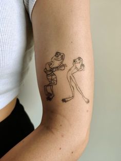 a woman with a tattoo on her arm