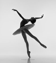 a black and white photo of a ballerina