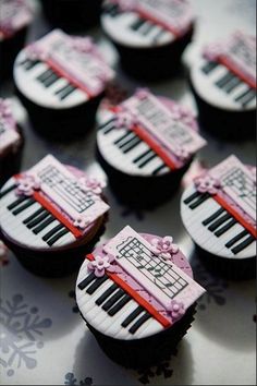 cupcakes decorated with music notes and piano keys