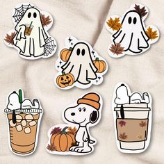 four halloween stickers on a sheet with pumpkins, ghost and jack - o'- lantern