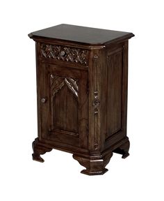 an old wooden cabinet with carvings on the front and side doors, sitting against a white background