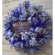 a blue and white wreath that says welcome to our home