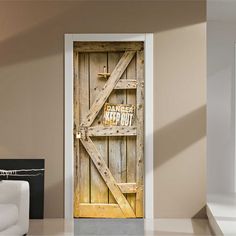 an open door with a sign on it in a living room next to a white couch