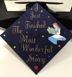 a graduation cap that says i just finished the most wonderful story