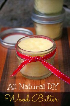 two jars with some food in them on a table and the words, all natural diy wood butter