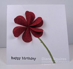 a birthday card with a red flower on it