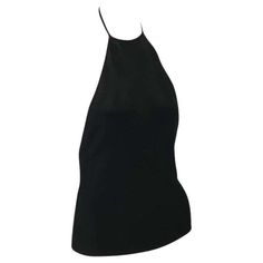 For Sale on 1stDibs - Presenting a black backless halterneck Gucci top, designed by Tom Ford. From the late 1990s, this incredible new with tags top is constructed of stretchy Summer Fitted Gucci Tops, Black Backless Top For Evening, Backless Black Top For Evening, Elegant Fitted Gucci Tops, Elegant Black High Neck Halter Top, Black High Neck Halter Top For Night Out, Chic Black High Neck Halter Top, Fitted Gucci Top For Night Out, Gucci Black Top For Night Out