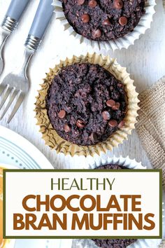 healthy chocolate bran muffins on top of a table with forks and spoons