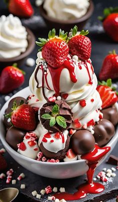 a white bowl filled with chocolate covered strawberries and ice cream on top of a table