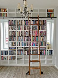 a ladder stands in front of a bookshelf full of books