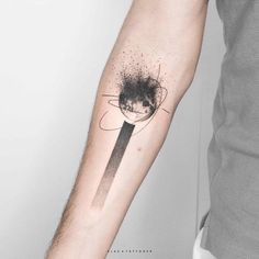 a person with a black ink tattoo on their arm