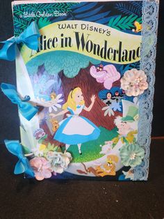 a book with an image of alice in wonderland on it