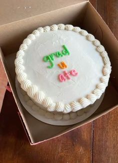 a birthday cake in a box with writing on it