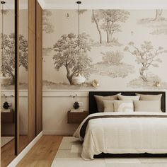 a bedroom with a bed, mirror and wallpaper in the background that has trees on it