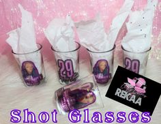 shot glasses with purple hair and white paper in them