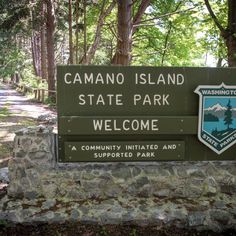 there is a sign that says camano island state park welcomes you to the community